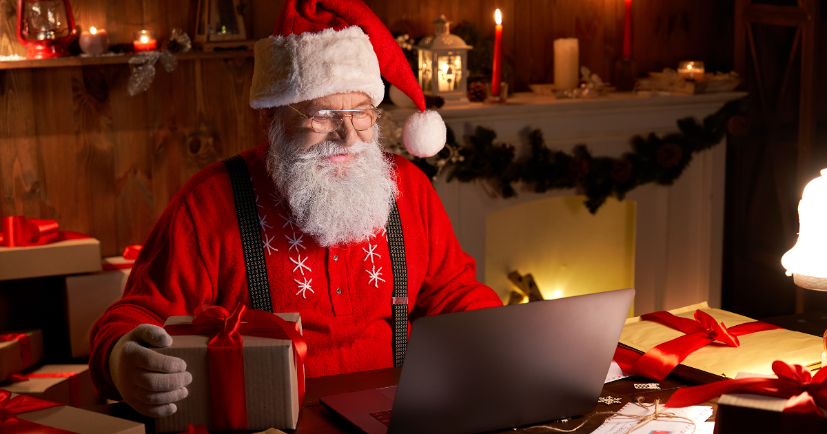 Santa Checking His Stock Portfolio in the Workshop